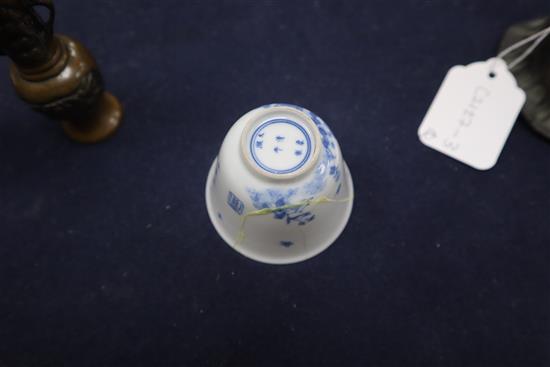 A Chinese bronze bell, a pair of miniature bronze vases and a blue and white cup with Kangxi mark tallest 15cm